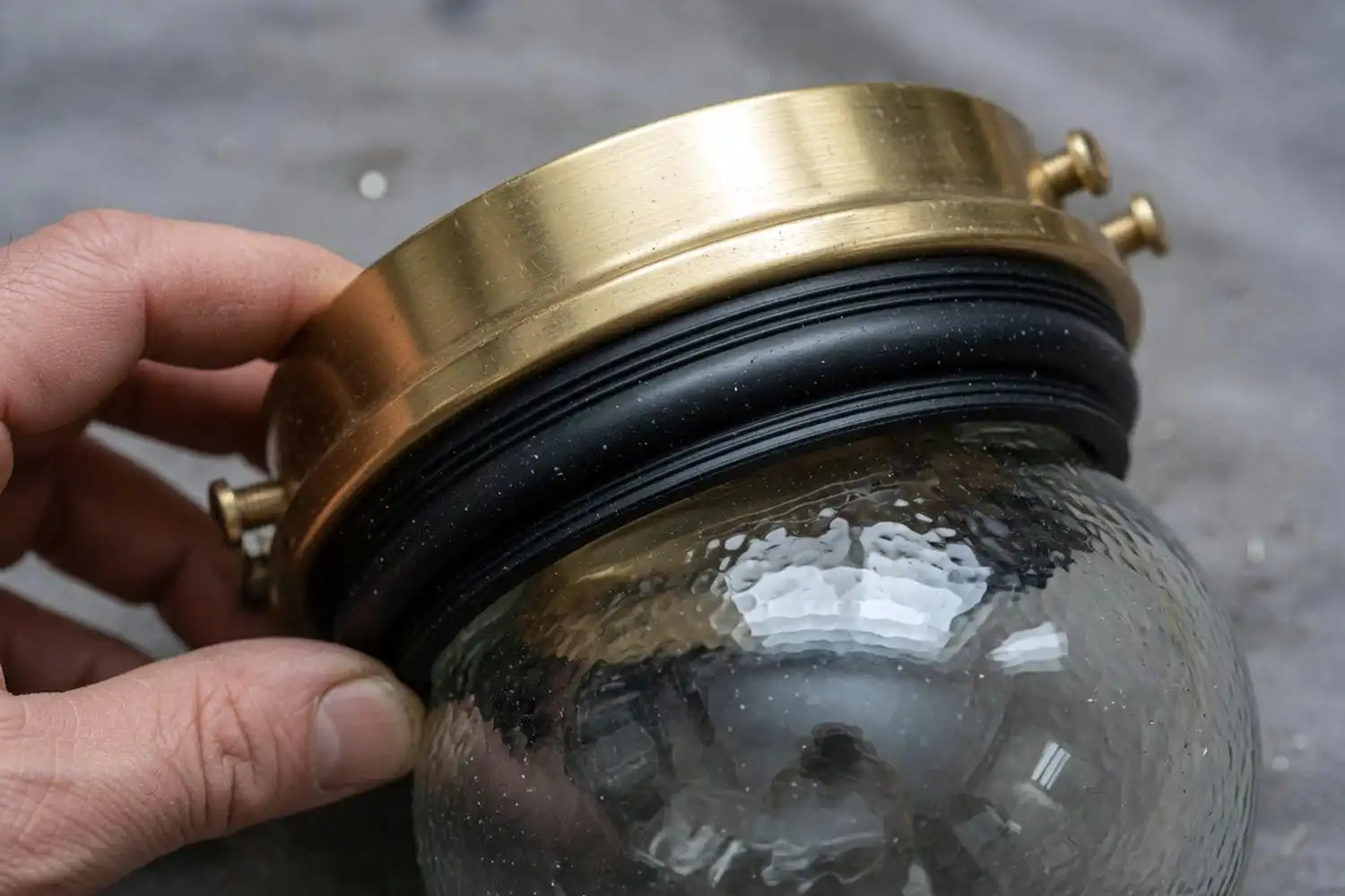 silicone gasket and brass body on an outdoor rated bulkhead light fixture